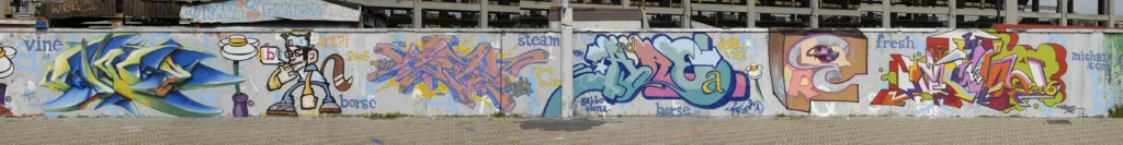 Murale collettivo con più graffiti su muro urbano, Arona 2006.