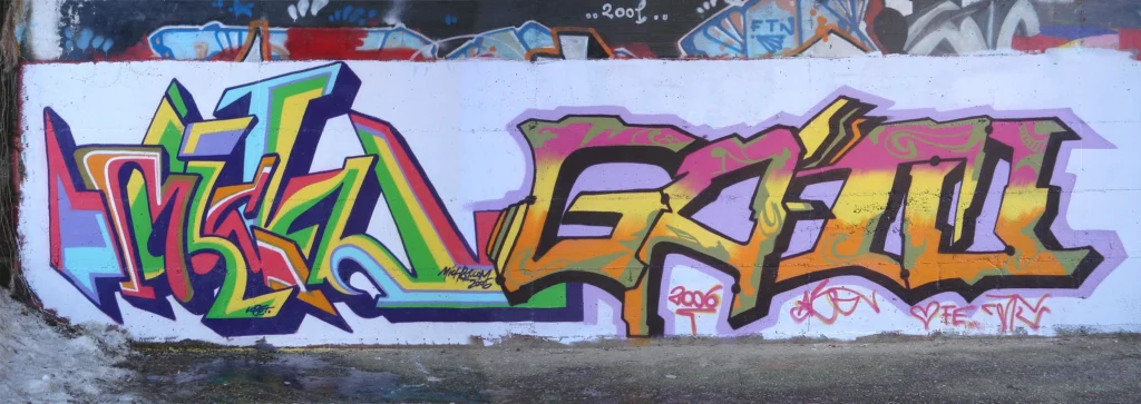 Murale a due mani con graffiti astratti e cromie calde, Tradate 2006.